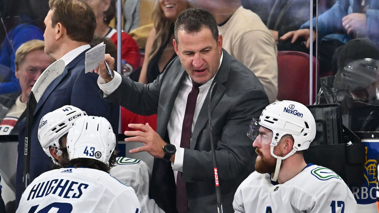 MONTREAL, CANADA - NOVEMBER 12: Adam Foote, assistant coach of the Vancouver Canucks, handles bench duties during the second period against the Montreal Canadiens at the Bell Centre on November 12, 2023 in Montreal, Quebec, Canada. The Vancouver Canucks defeated the Montreal Canadiens 5-2.