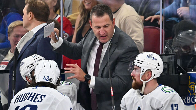 MONTREAL, CANADA - NOVEMBER 12: Adam Foote, assistant coach of the Vancouver Canucks, handles bench duties during the second period against the Montreal Canadiens at the Bell Centre on November 12, 2023 in Montreal, Quebec, Canada. The Vancouver Canucks defeated the Montreal Canadiens 5-2.