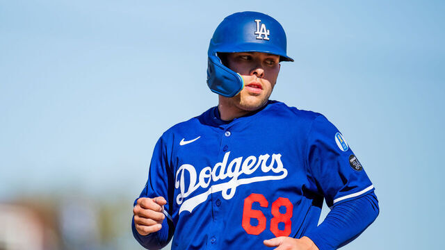 GLENDALE, ARIZONA - MARCH 09: Dalton Rushing #68 of the Los Angeles Dodgers runs across the field during the seventh inning of a Spring Training game against the Athletics at Camelback Ranch on March 09, 2025 in Glendale, Arizona.