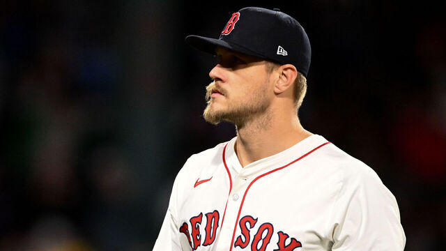 BOSTON, MASSACHUSETTS - APRIL 09: Tanner Houck #89 of the Boston Red Sox walks off of the field after being taken out of the game against the Toronto Blue Jays during the seventh inning at Fenway Park on April 09, 2025 in Boston, Massachusetts.