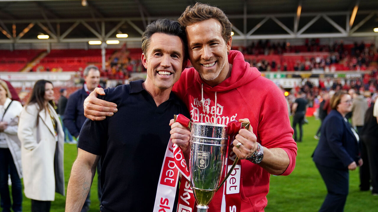 Wrexham co-owners Ryan Reynolds (right) and Rob McElhenney celebrate with the trophy after the Sky Bet League One match at SToK Racecourse, Wrexham. Picture date: Saturday April 26, 2025.