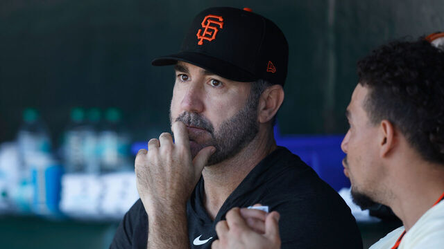 SAN FRANCISCO, CALIFORNIA - MAY 04: Justin Verlander #35 of the San Francisco Giants talks to teammate Willy Adames #2 in the dugout during the game against the Colorado Rockies at Oracle Park on May 04, 2025 in San Francisco, California.