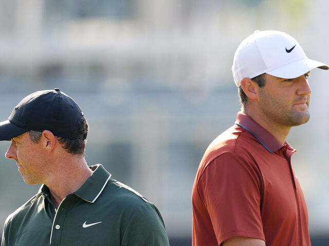 CHARLOTTE, NORTH CAROLINA - MAY 15: Scottie Scheffler of the United States and Rory McIlroy of Northern Ireland look on while playing the 10th hole during the first round of the PGA Championship at Quail Hollow Country Club on May 15, 2025 in Charlotte, North Carolina.
