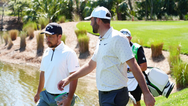 PONTE VEDRA BEACH, FL - MARCH 13: PGA golfers Xander Schauffele and Scottie Scheffler walk the 5th hole during the The Players Championship at the Stadium Course at TPC Sawgrass on March 13, 2025, at Ponte Verde Beach, Florida.