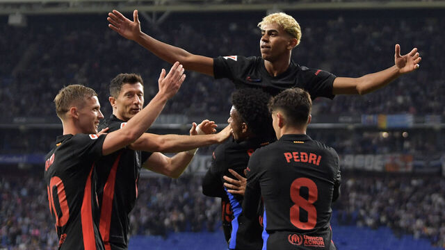 Barcelona's Spanish forward #19 Lamine Yamal (C) celebrates scoring his team's first goal during the Spanish league football match between RCD Espanyol and FC Barcelona at the RCDE Stadium in Cornella de Llobregat, on May 15, 2025.