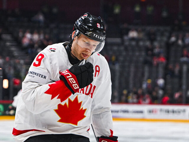 Canada's forward #09 Nathan Mackinnon reacts after scoring 1-1 during the IIHF Men's Ice Hockey World Championship Group A match between Canada and Austria at the Avicii Arena in Stockholm, on May 15, 2025.
