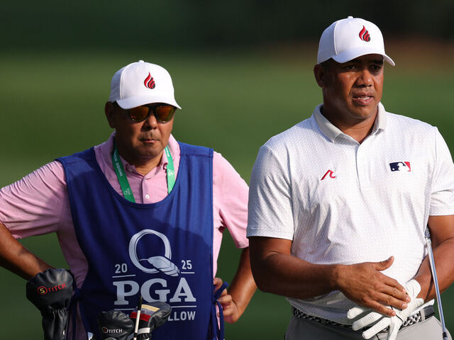CHARLOTTE, NORTH CAROLINA - MAY 15: Jhonattan Vegas of Venezuela talks with his caddie Oscar Ruben Yorio on the third hole during the first round of the PGA Championship at Quail Hollow Country Club on May 15, 2025 in Charlotte, North Carolina.