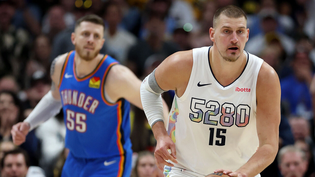 DENVER, COLORADO - MAY 15: Nikola Jokic #15 of the Denver Nuggets dribbles the ball ahead of Isaiah Hartenstein #55 of the Oklahoma City Thunder during the first quarter in Game Six of the Western Conference Second Round NBA Playoffs at Ball Arena on May 15, 2025 in Denver, Colorado.