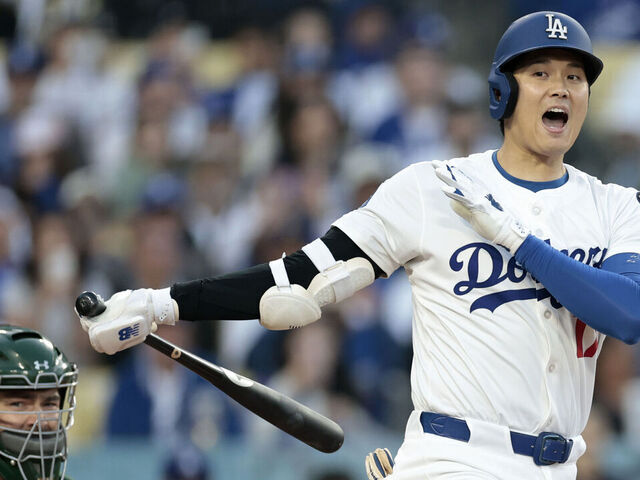 LOS ANGELES, CALIFORNIA - MAY 15: Shohei Ohtani #17 of the Los Angeles Dodgers reacts in front of Shea Langeliers #23 of the Athletics during his at bat in the first inning at Dodger Stadium on May 15, 2025 in Los Angeles, California.