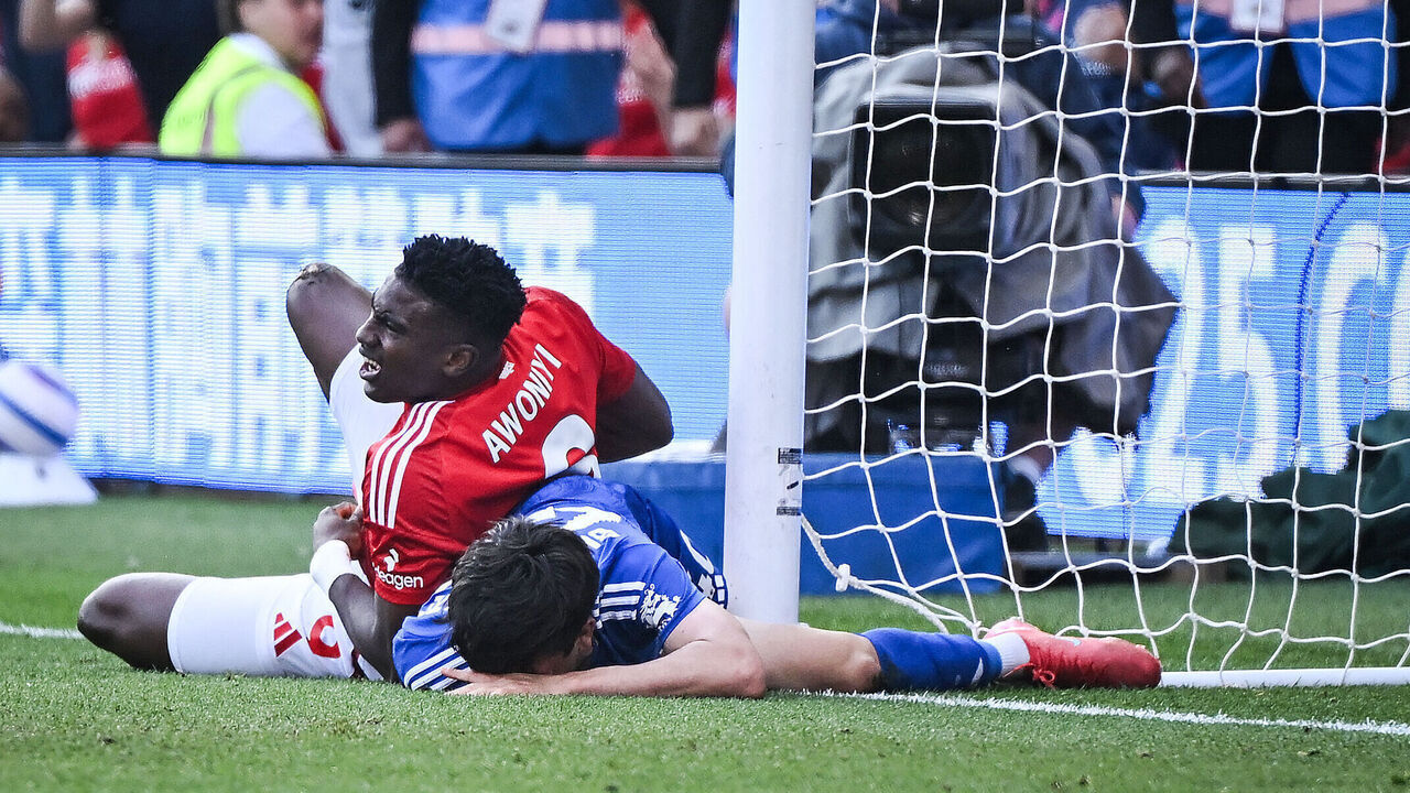 Nottingham Forest's Nigerian striker #09 Taiwo Awoniyi (L) and Leicester City's Argentinian midfielder #40 Facundo Buonanotte (R) react after colliding during the English Premier League football match between Nottingham Forest and Leicester City at The City Ground in Nottingham, central England, on May 11, 2025.