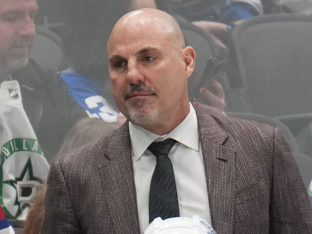 DALLAS, TX - APRIL 8: Rick Tocchet watches the action from behind the bench against the Dallas Stars at the American Airlines Center on April 8, 2025 in Dallas, Texas.