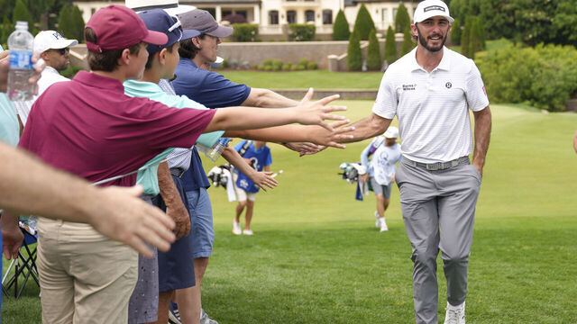 lang="x-default" CHARLOTTE, NC - MAY 16: Max Homa high fives spectators on his way to the eighth hole tee box during the second round of the PGA Championship at Quail Hollow Club on Friday, May 16, 2025 in Charlotte, North Carolina.