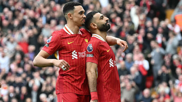 Liverpool's Egyptian striker #11 Mohamed Salah (R) celebrates scoring the team's second goal with Liverpool's English defender #66 Trent Alexander-Arnold during the English Premier League football match between Liverpool and Southampton at Anfield in Liverpool, north west England on March 8, 2025.