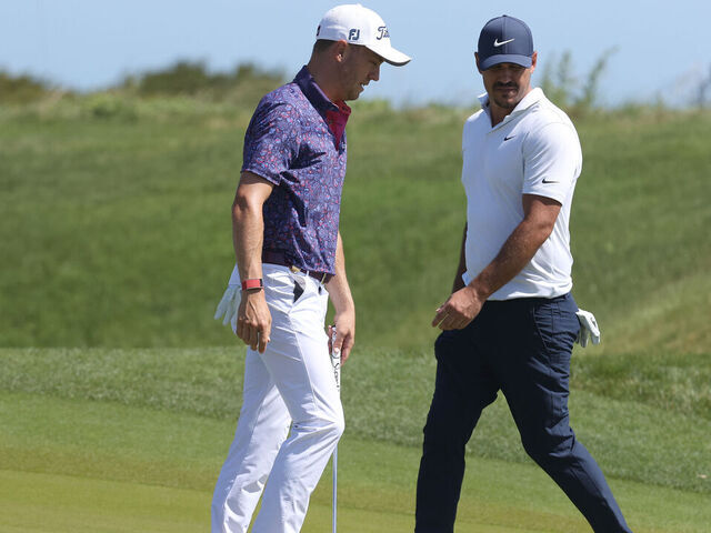 KIAWAH ISLAND, SOUTH CAROLINA - MAY 21: (L-R) Justin Thomas of the United States and Brooks Koepka of the United States prepare to putt on the sixth green during the second round of the 2021 PGA Championship at Kiawah Island Resort's Ocean Course on May 21, 2021 in Kiawah Island, South Carolina.