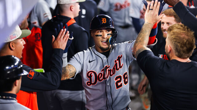 TORONTO, CANADA - MAY 16: Javier Báez #28 of the Detroit Tigers celebrates in the dugout after hitting a solo-home run in the eighth inning of their MLB game against the Toronto Blue Jays at Rogers Centre on May 16, 2025 in Toronto, Ontario, Canada.