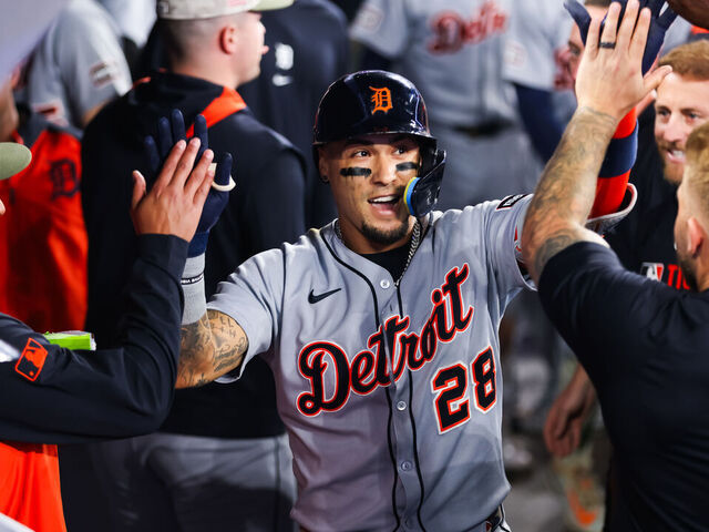 TORONTO, CANADA - MAY 16: Javier Báez #28 of the Detroit Tigers celebrates in the dugout after hitting a solo-home run in the eighth inning of their MLB game against the Toronto Blue Jays at Rogers Centre on May 16, 2025 in Toronto, Ontario, Canada.