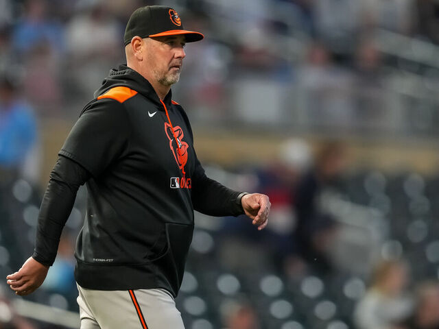 MINNEAPOLIS, MN - MAY 07 : Manager Brandon Hyde #18 of the Baltimore Orioles looks on against the Minnesota Twins on May 7, 2025 at Target Field in Minneapolis, Minnesota.