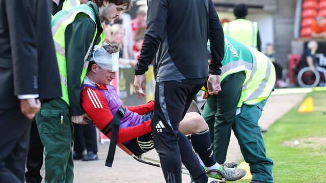 DUNDEE, SCOTLAND - MAY 17: Aberdeen's Jack MacKenzie receives treatment after being hit with an object from the crowd during a William Hill Premiership match between Dundee United and Aberdeen at the CalForth Construction Arena at Tannadice Park, on May 17, 2025, in Dundee, Scotland.