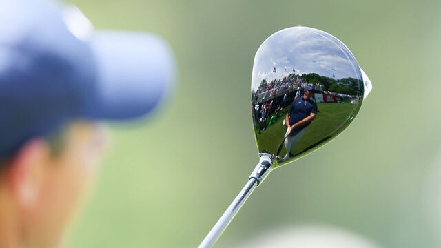 CHARLOTTE, NORTH CAROLINA - MAY 17: Rory McIlroy of Northern Ireland reflection is seen in his club on the practice range during the third round of the PGA Championship at Quail Hollow Country Club on May 17, 2025 in Charlotte, North Carolina.
