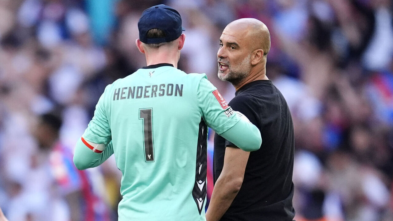 Crystal Palace goalkeeper Dean Henderson and Manchester City manager Pep Guardiola react following the Emirates FA Cup final at Wembley Stadium, London. Picture date: Saturday May 17, 2025.