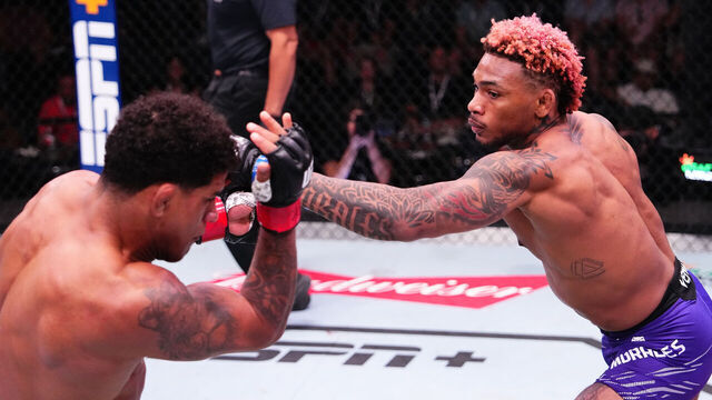 LAS VEGAS, NEVADA - MAY 17: (R-L) Michael Morales of Ecuador punches Gilbert Burns of Brazil in a welterweight fight during the UFC Fight Night event at UFC APEX on May 17, 2025 in Las Vegas, Nevada.