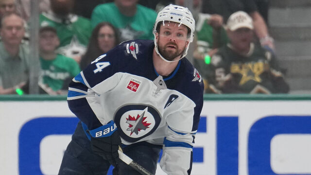 DALLAS, TX - MAY 13: Josh Morrissey #44 of the Winnipeg Jets handles the puck against the Dallas Stars in the second period of Game Four of the Second Round of the 2025 Stanley Cup Playoffs at the American Airlines Center on may 13, 2025 in Dallas, Texas.