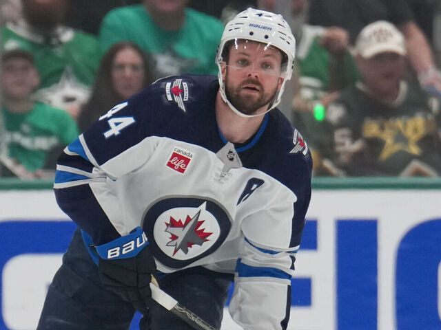 DALLAS, TX - MAY 13: Josh Morrissey #44 of the Winnipeg Jets handles the puck against the Dallas Stars in the second period of Game Four of the Second Round of the 2025 Stanley Cup Playoffs at the American Airlines Center on may 13, 2025 in Dallas, Texas.