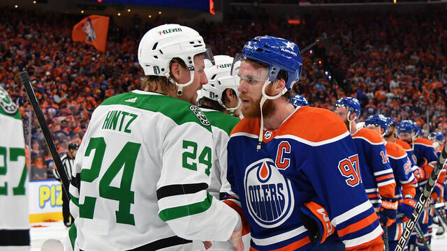 EDMONTON, CANADA - JUNE 02: Connor McDavid #97 of the Edmonton Oilers shakes hands with Roope Hintz #24 of the Dallas Stars after clinching the series in Game Six of the Western Conference Final of the 2024 Stanley Cup Playoffs at Rogers Place on June 2, 2024, in Edmonton, Alberta, Canada.
