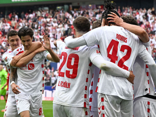 18 May 2025, North Rhine-Westphalia, Cologne: Soccer, Bundesliga 2, 1. FC Köln - 1. FC Kaiserslautern, Matchday 34, RheinEnergieStadion, Cologne players celebrate the 2:0 goal. IMPORTANT NOTE: In accordance with the regulations of the DFL German Football League and the DFB German Football Association, it is prohibited to use or have used photographs taken in the stadium and/or of the match in the form of sequential images and/or video-like photo series. Photo: Federico Gambarini/dpa