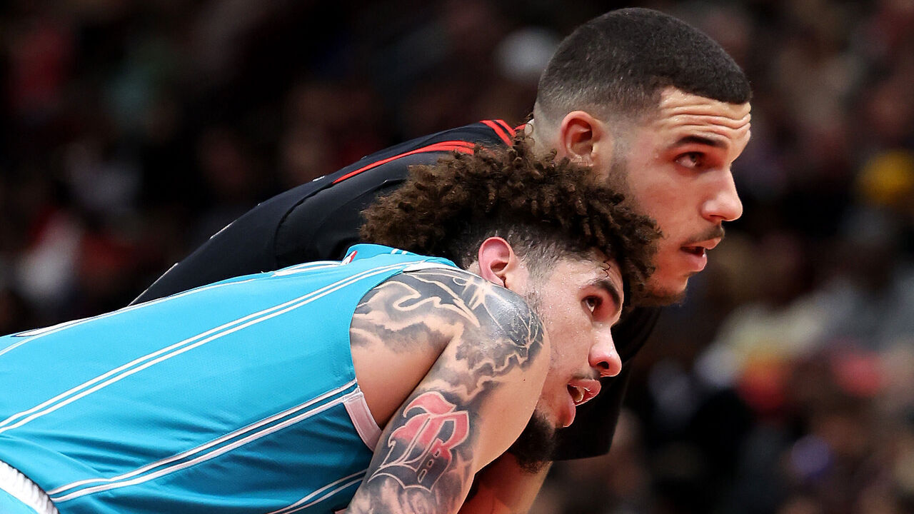 CHICAGO, ILLINOIS - JANUARY 17: LaMelo Ball #1 of the Charlotte Hornets and Lonzo Ball #2 of the Chicago Bulls look on during the second half at the United Center on January 17, 2025 in Chicago, Illinois.