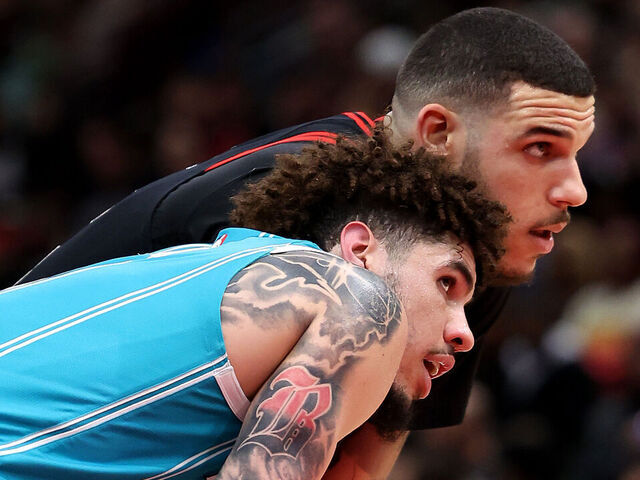 CHICAGO, ILLINOIS - JANUARY 17: LaMelo Ball #1 of the Charlotte Hornets and Lonzo Ball #2 of the Chicago Bulls look on during the second half at the United Center on January 17, 2025 in Chicago, Illinois.
