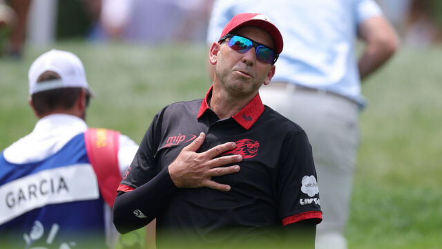 CHARLOTTE, NORTH CAROLINA - MAY 15: Sergio Garcia of Spain and Daniel Berger of the United States debate Berger's lie on the second hole during the first round of the PGA Championship at Quail Hollow Country Club on May 15, 2025 in Charlotte, North Carolina.