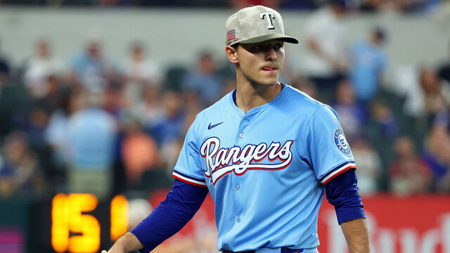 ARLINGTON, TEXAS - MAY 18: Jack Leiter #35 of the Texas Rangers walks to the dugout after being relieved in the eighth inning in a game against the Houston Astros at Globe Life Field on May 18, 2025 in Arlington, Texas.