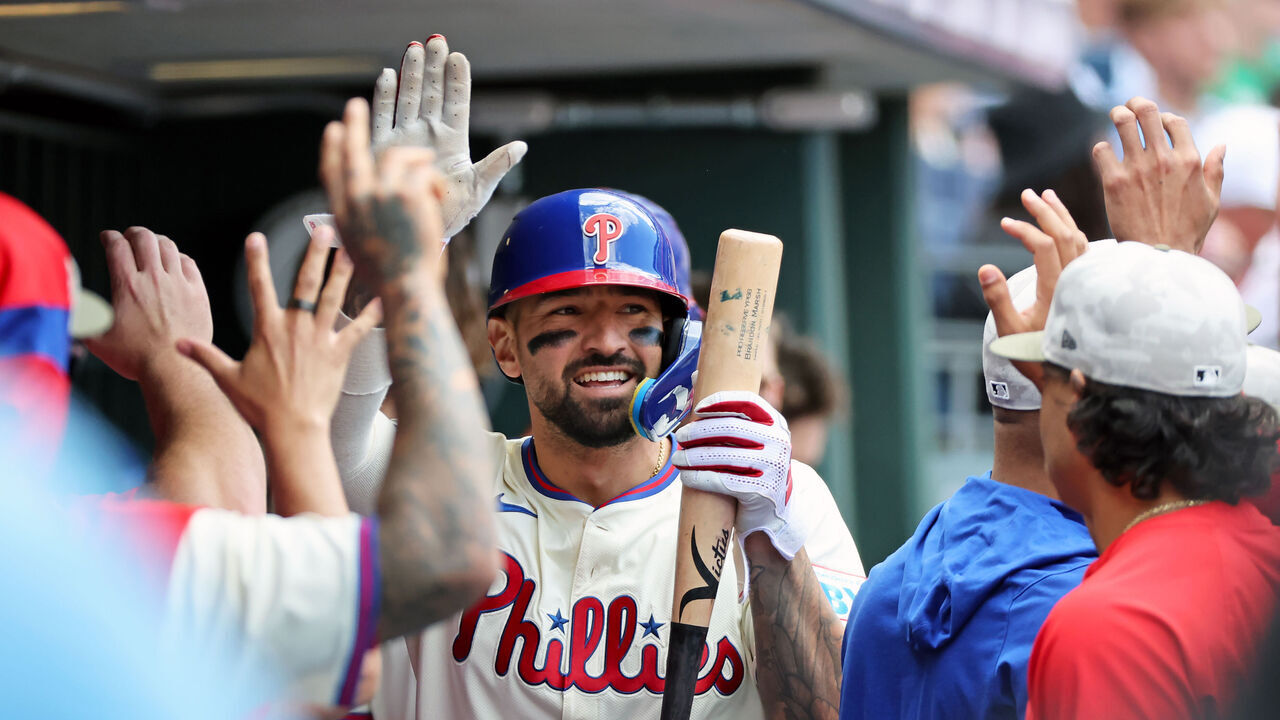 PHILADELPHIA, PENNSYLVANIA - MAY 18: Nick Castellanos #8 of the Philadelphia Phillies high-fives teammates in the dugout after scoring a run in the fifth inning during a game against the Pittsburgh Pirates at Citizens Bank Park on May 18, 2025 in Philadelphia, Pennsylvania. The Phillies won 1-0.