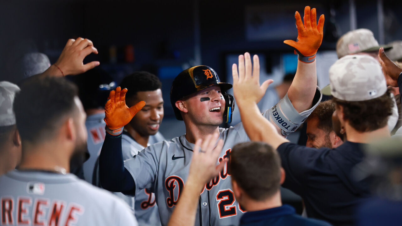 TORONTO, ON - MAY 17: Spencer Torkelson #20 of the Detroit Tigers celebrates in the dugout with teammates after hitting a solo home run in the second inning during a game against the Toronto Blue Jays at Rogers Centre on May 17, 2025 in Toronto, Ontario, Canada.