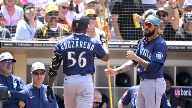 SAN DIEGO, CALIFORNIA - MAY 18: Randy Arozarena #56 of the Seattle Mariners is congratulated by J.P. Crawford #3 after Arozarena hit a home run against the San Diego Padres during the fourth inning at Petco Park on May 18, 2025 in San Diego, California.
