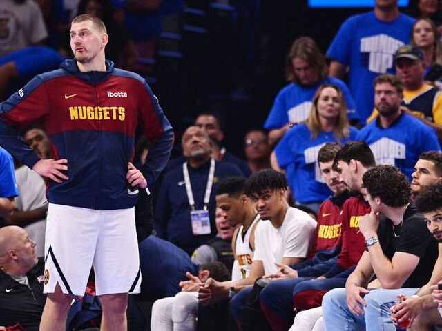 OKLAHOMA CITY, OKLAHOMA - MAY 18: Nikola Jokic #15 and the Denver Nuggets starters look on from the bench during the fourth quarter of a game against the Oklahoma City Thunder in Game Seven of the Western Conference Second Round NBA Playoffs at Paycom Center on May 18, 2025 in Oklahoma City, Oklahoma.