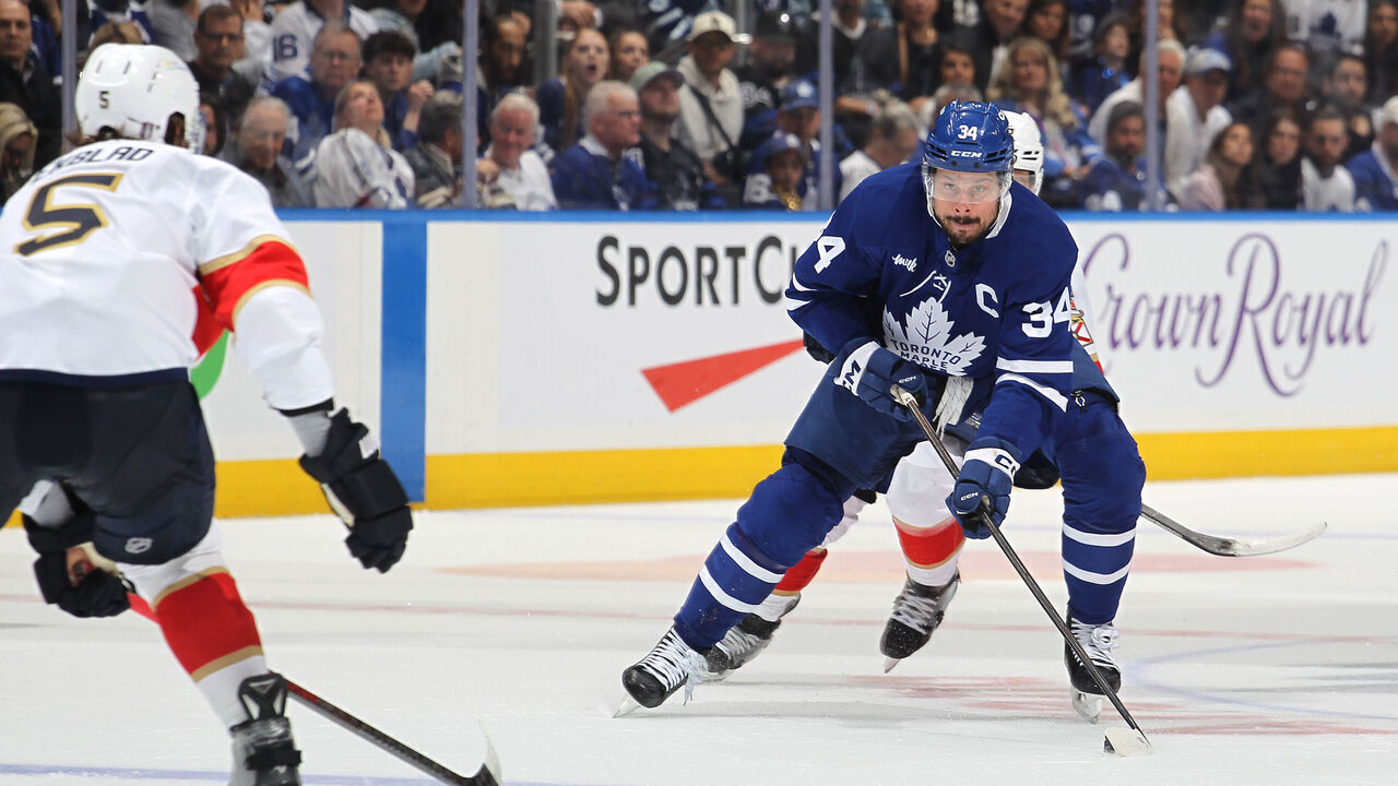 TORONTO, CANADA - MAY 18: Auston Matthews #34 of the Toronto Maple Leafs skates with the puck against Aaron Ekblad #5 of the Florida Panthers during the second period in Game Seven of the Second Round of the 2025 Stanley Cup Playoffs at Scotiabank Arena on May 18, 2025 in Toronto, Ontario, Canada.