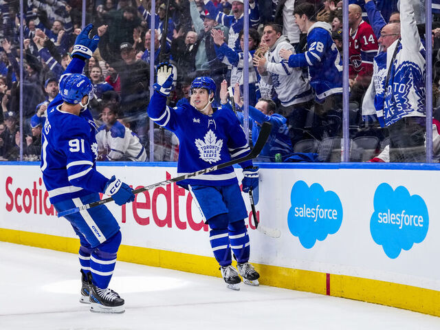 TORONTO, ON - APRIL 12: Mitch Marner #16 of the Toronto Maple Leafs celebrates his game winning goal against the Montreal Canadiens with teammate John Tavares #91 in overtime at the Scotiabank Arena on April 12, 2025 in Toronto, Ontario, Canada.