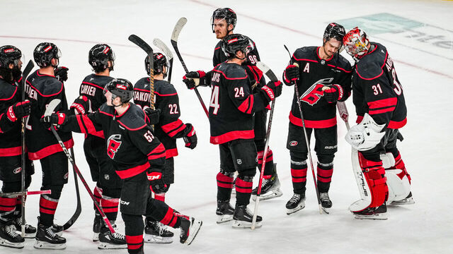 RALEIGH, NORTH CAROLINA - MAY 10: Sebastian Aho #20 and the Carolina Hurricanes celebrate with goaltender Frederik Andersen #31 of the Carolina Hurricanes after defeating the Washington Capitals 4-0 in Game Three of the Second Round of the 2025 Stanley Cup Playoffs at Lenovo Center on May 10, 2025 in Raleigh, North Carolina.