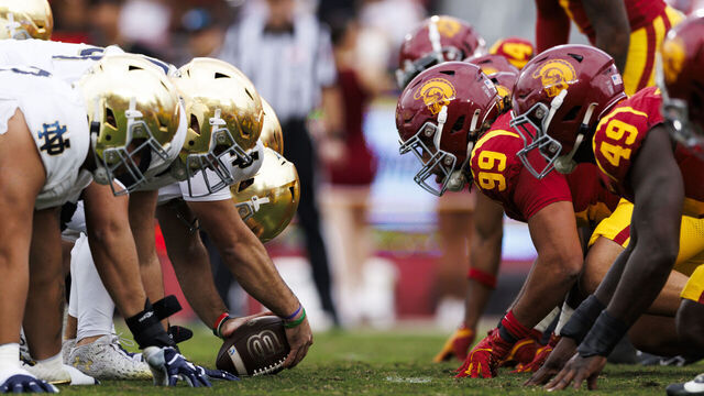 LOS ANGELES, CALIFORNIA - NOVEMBER 30: Notre Dame Fighting Irish offense and USC Trojans defense at the line of scrimmage before an extra point attempt during the first half at United Airlines Field at the Los Angeles Memorial Coliseum on November 30, 2024 in Los Angeles, California.