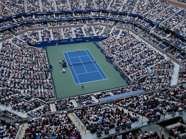 TOPSHOT - An overall view inside Arthur Ashe Stadium as Italy's Jannik Sinner and Australia's Christopher O'Connell play during their men's singles third round match on day six of the US Open tennis tournament at the USTA Billie Jean King National Tennis Center in New York City, on August 31, 2024.