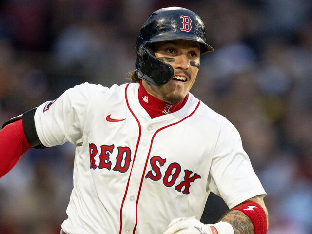 BOSTON, MASSACHUSETTS - MAY 19: Jarren Duran #16 of the Boston Red Sox runs after hitting a triple during the second inning of a game against the New York Mets at Fenway Park in Boston, Massachusetts.