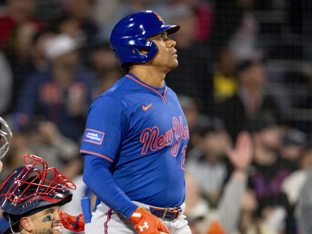 BOSTON, MASSACHUSETTS - MAY 19: Juan Soto #22 of the New York Mets hits a single during the sixth inning of a game against the Boston Red Sox at Fenway Park in Boston, Massachusetts.