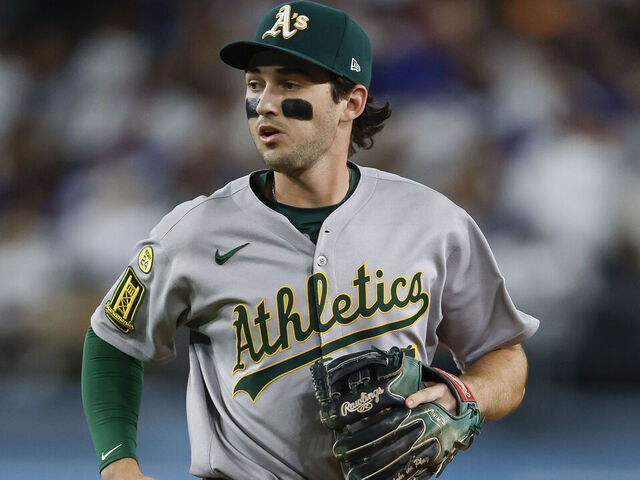 LOS ANGELES, CALIFORNIA - MAY 15: Jacob Wilson #5 of the Athletics jogs to the dugout at the end of the sixth inning during a game against the Los Angeles Dodgers at Dodger Stadium on May 15, 2025 in Los Angeles, California.