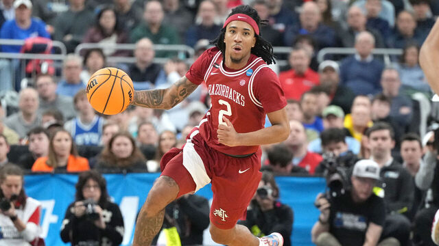 PROVIDENCE, RHODE ISLAND - MARCH 22: Boogie Fland #2 of the Arkansas Razorbacks dribbles up court during a second round game against the St. John's Red Storm in the NCAA Men's Basketball Tournament at Amica Mutual Pavillion on March 22, 2025 in Providence, Rhode Island.