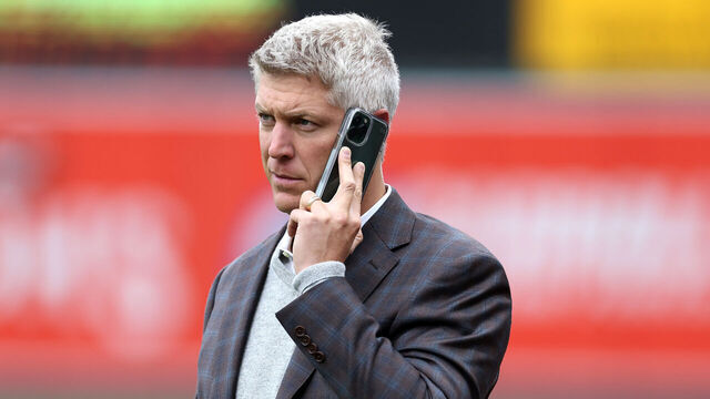 BALTIMORE, MARYLAND - APRIL 08: Baltimore Orioles general manager Mike Elias talks on the phone before the start of the Orioles and New York Yankees game at Oriole Park at Camden Yards on April 08, 2023 in Baltimore, Maryland.