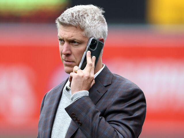 BALTIMORE, MARYLAND - APRIL 08: Baltimore Orioles general manager Mike Elias talks on the phone before the start of the Orioles and New York Yankees game at Oriole Park at Camden Yards on April 08, 2023 in Baltimore, Maryland.