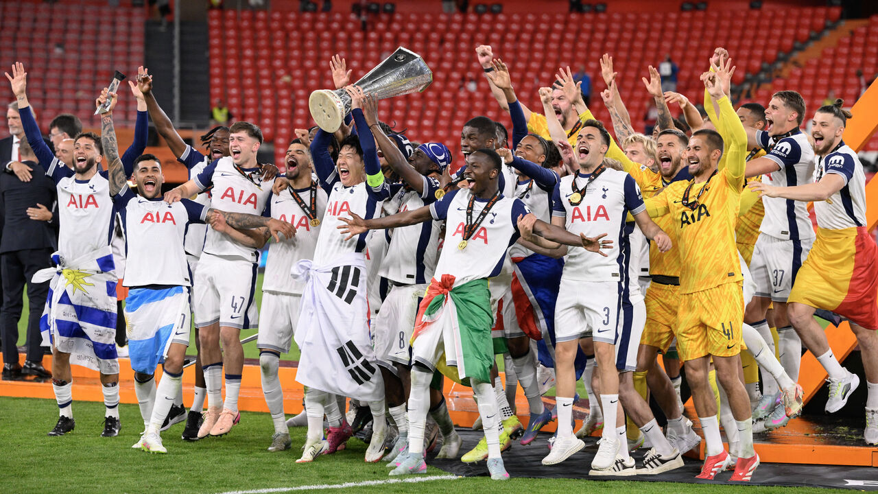 Tottenham Hotspur's South Korean forward #07 Son Heung-min raises the trophy as he celebrates with teammates winning the UEFA Europa League final football match between Tottenham Hotspur and Manchester United at San Mames stadium in Bilbao on May 21, 2025.