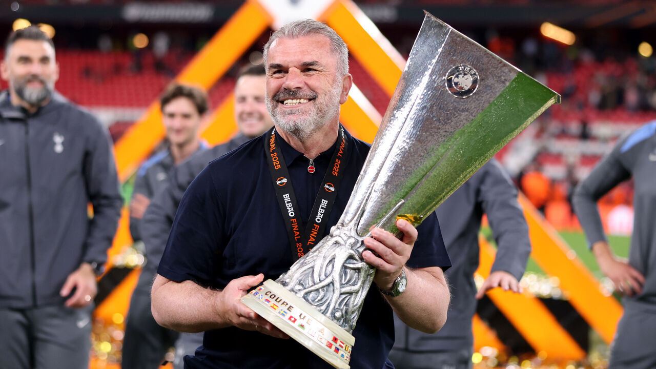 BILBAO, SPAIN - MAY 21: Ange Postecoglou, Manager of Tottenham Hotspur, celebrates with the UEFA Europa League trophy after his team's victory in the UEFA Europa League Final 2025 between Tottenham Hotspur and Manchester United at Estadio de San Mames on May 21, 2025 in Bilbao, Spain.